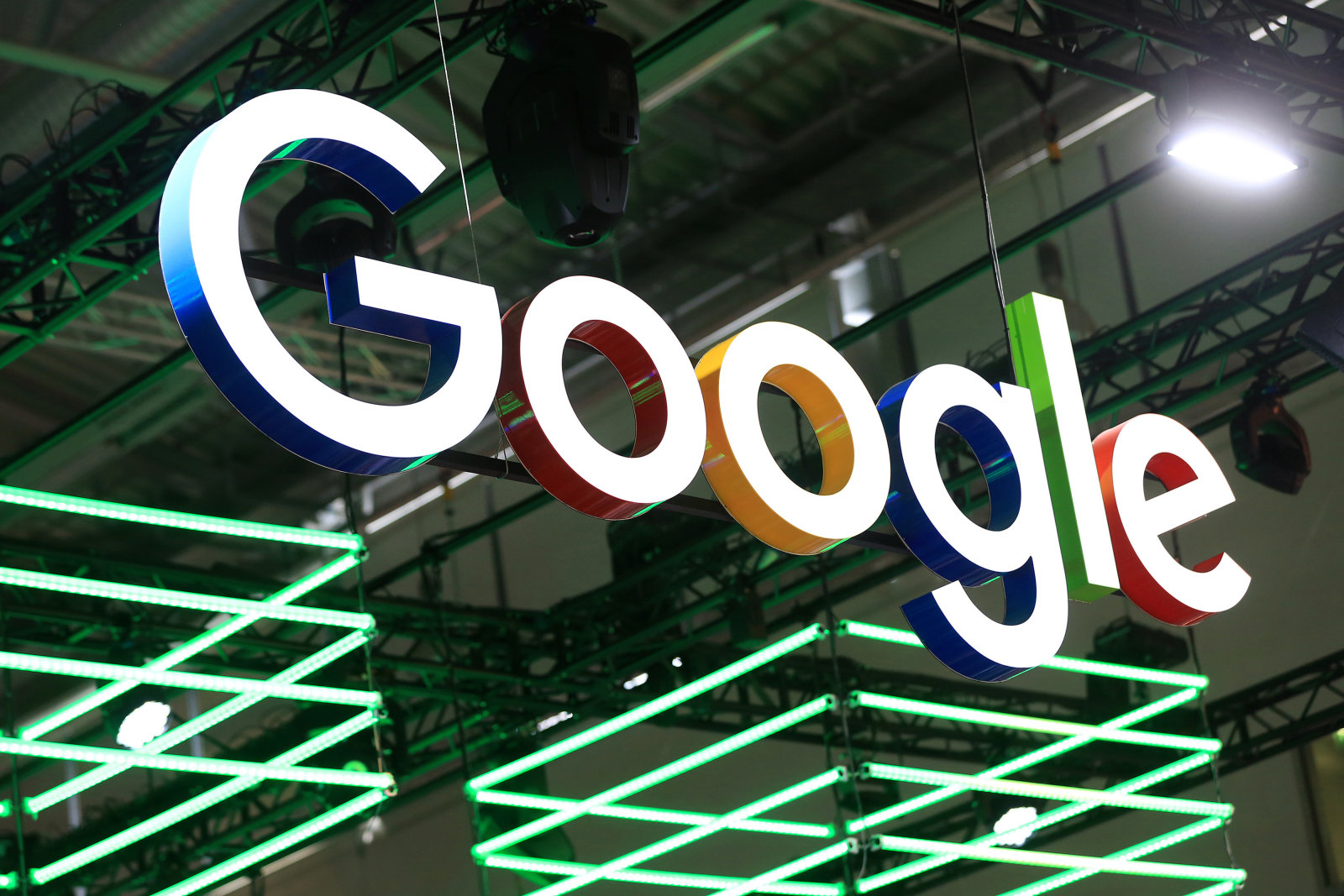 The Google Inc. logo hangs illuminated over the company's exhibition stand at the Dmexco digital marketing conference in Cologne, Germany, on Wednesday, Sept. 14, 2016. Dmexco is a two-day global business and digital economy innovation platform, attracting the industry's most important personalities and corporate decision-makers. Photographer: Krisztian Bocsi/Bloomberg via Getty Images