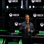Phil Spencer, executive vice president of Gaming for Microsoft Corp., speaks during the company's Xbox event ahead of the E3 Electronic Entertainment Expo in Los Angeles, California, U.S., in Los Angeles, California, U.S., on Sunday, June 10, 2018. Xbox previewed a flurry of new titles and deals with studios as the video-gaming division of Microsoft looks to compete more intensely with Sony Corp.'s PlayStation and a resurgent Nintendo Co. Photographer: Patrick T. Fallon/Bloomberg via Getty Images