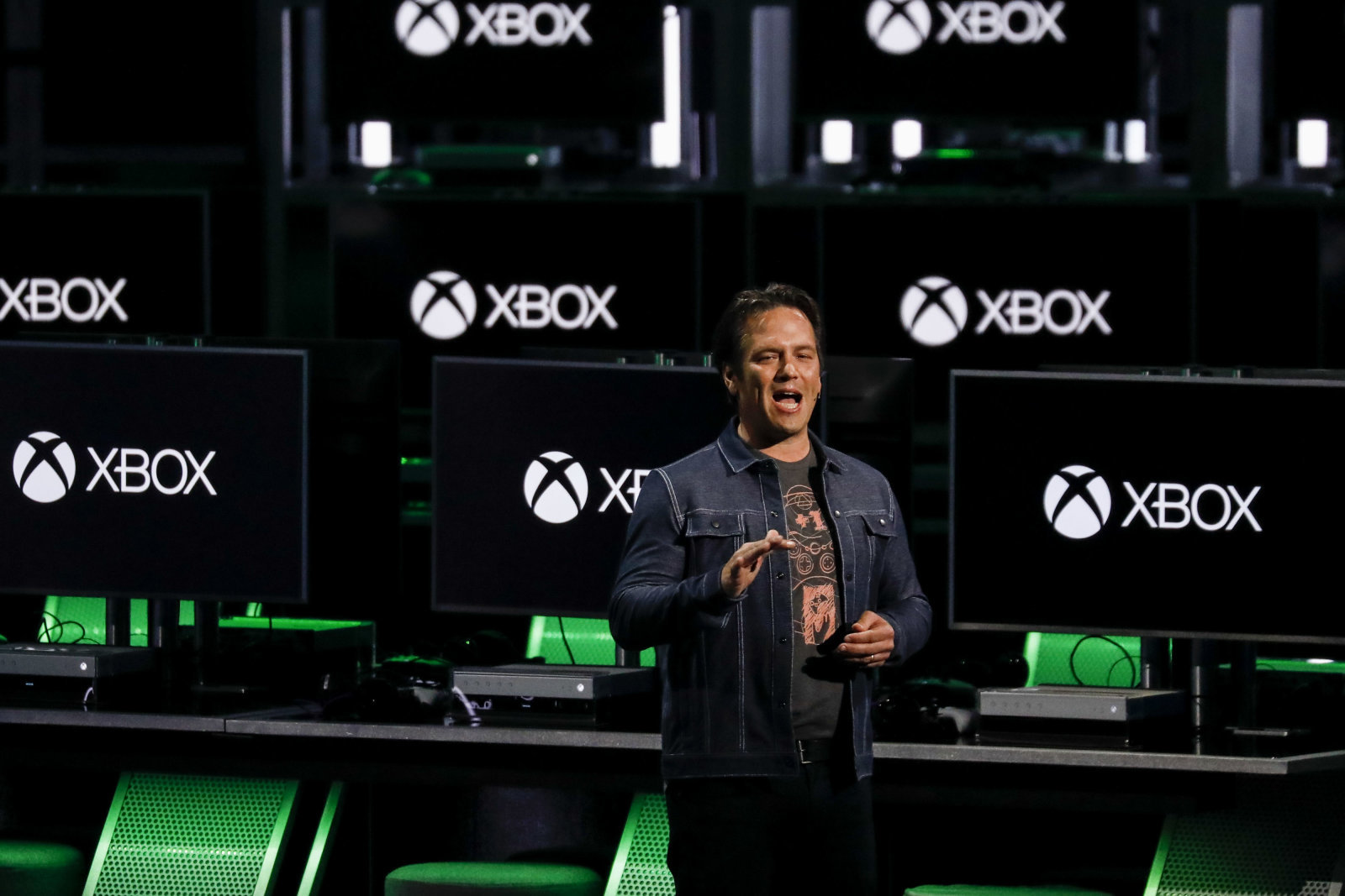 Phil Spencer, executive vice president of Gaming for Microsoft Corp., speaks during the company's Xbox event ahead of the E3 Electronic Entertainment Expo in Los Angeles, California, U.S., in Los Angeles, California, U.S., on Sunday, June 10, 2018. Xbox previewed a flurry of new titles and deals with studios as the video-gaming division of Microsoft looks to compete more intensely with Sony Corp.'s PlayStation and a resurgent Nintendo Co. Photographer: Patrick T. Fallon/Bloomberg via Getty Images