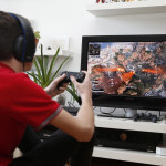PARIS, FRANCE - MARCH 13: In this photo illustration a teenager plays the video game Apex Legends developed by Respawn Entertainment and published by Electronic Arts (EA) on a Sony PlayStation game console PS4 Pro on March 13, 2019 in Paris, France. Apex Legends, a battle royale type video game continues to break new records every day, and now gathers more than 25 million players around the world. (Photo by Chesnot/Getty Images)