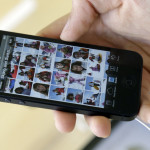 A costumer sets up an iPhone 5 at an Apple store in San Francisco,  Friday, Sept. 21, 2012. (AP Photo/Marcio Jose Sanchez)