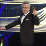 Alfonso Cuaron accepts the award for best cinematography for "Roma" at the Oscars on Sunday, Feb. 24, 2019, at the Dolby Theatre in Los Angeles. (Photo by Chris Pizzello/Invision/AP)