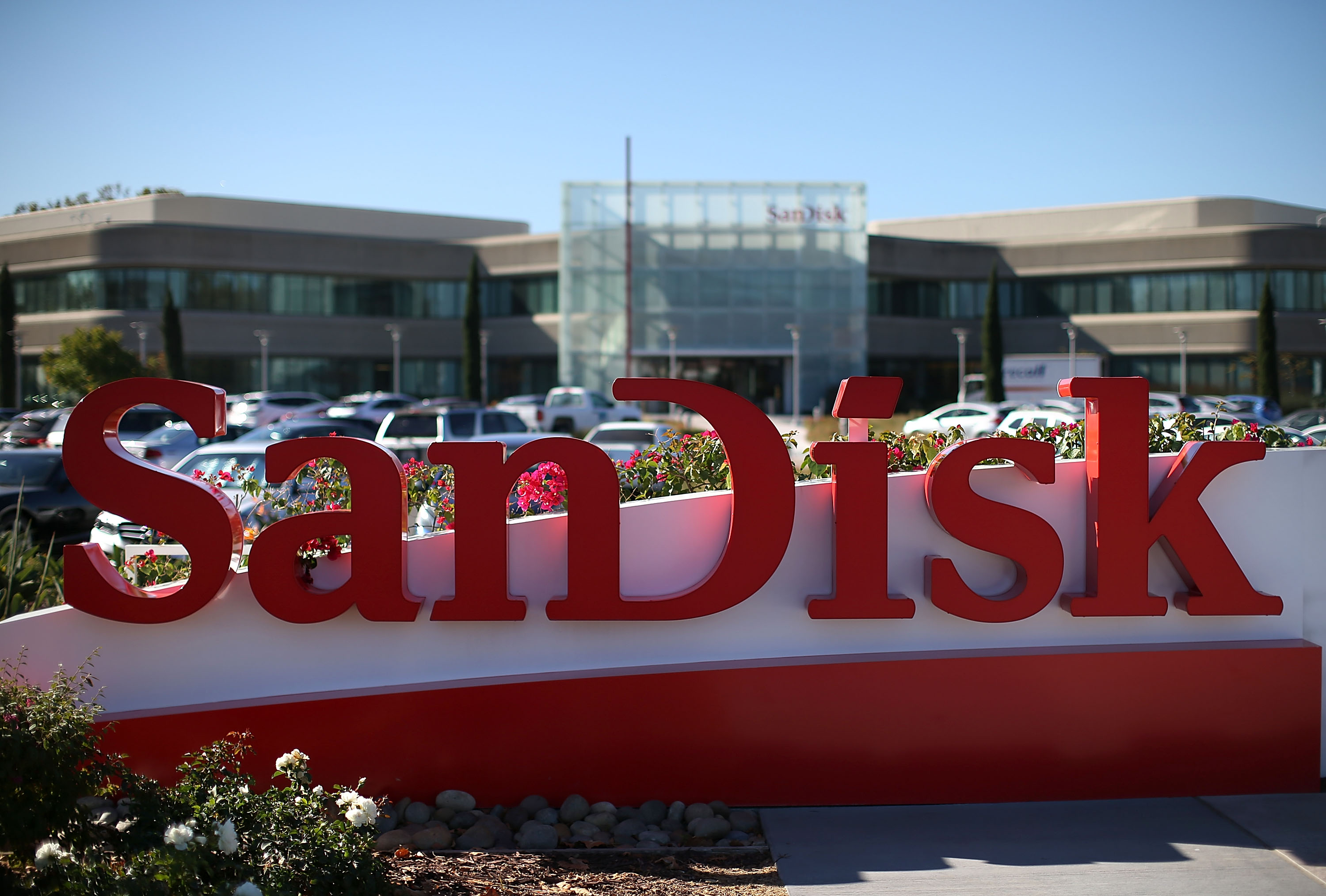 MILPITAS, CA - OCTOBER 21:  A sign is posted in front of the SanDisk headquarters on October 21, 2015 in Milpitas, California. Computer data storage company Western Digital announced plans to acquire flash memory storage maker SanDisk for $19 billion.  (Photo by Justin Sullivan/Getty Images)