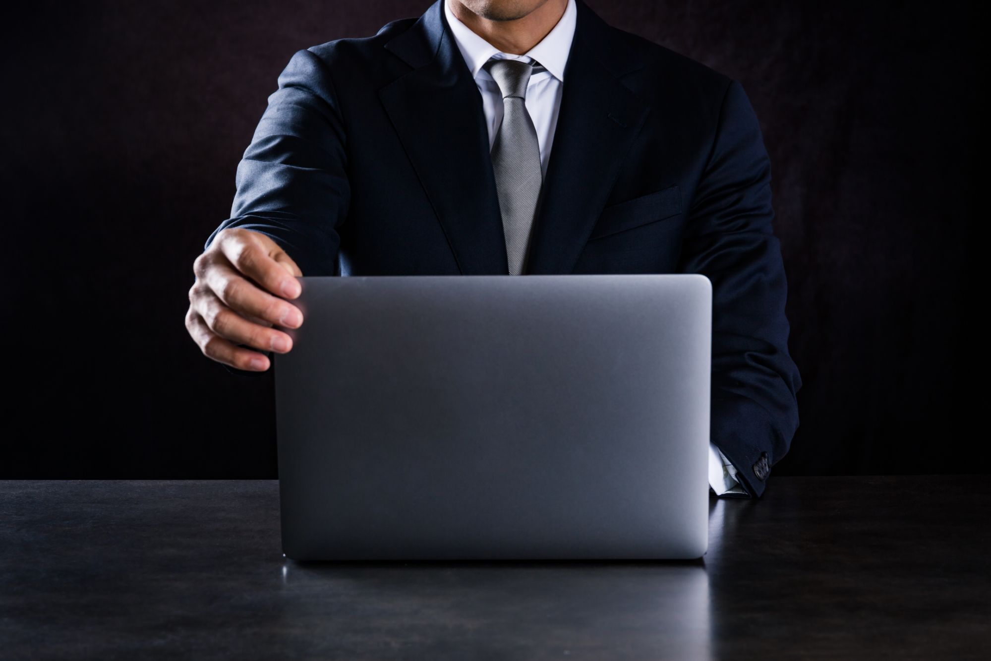 This is a photograph of businessman using laptop computer