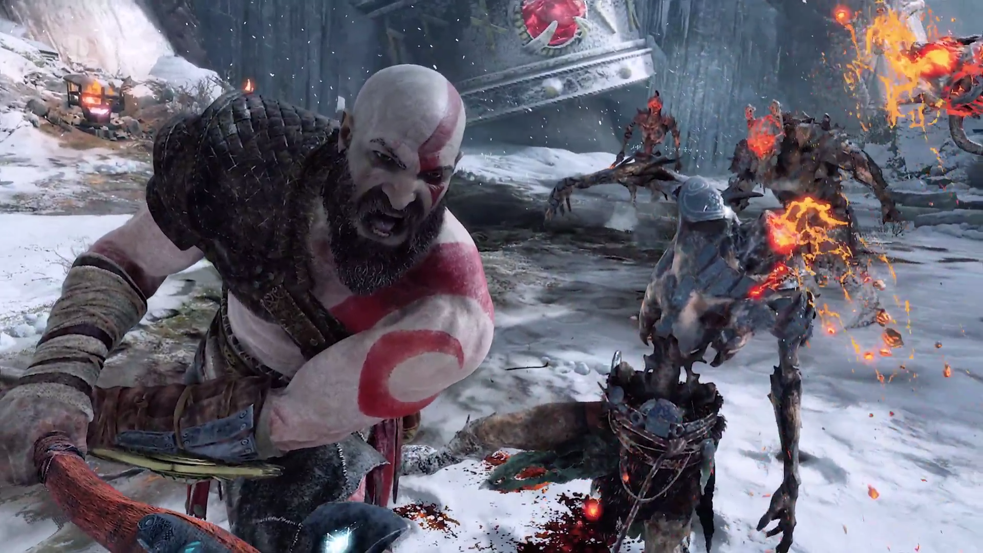God of War PS4 combat: Kratos in combat with a flaming enemy