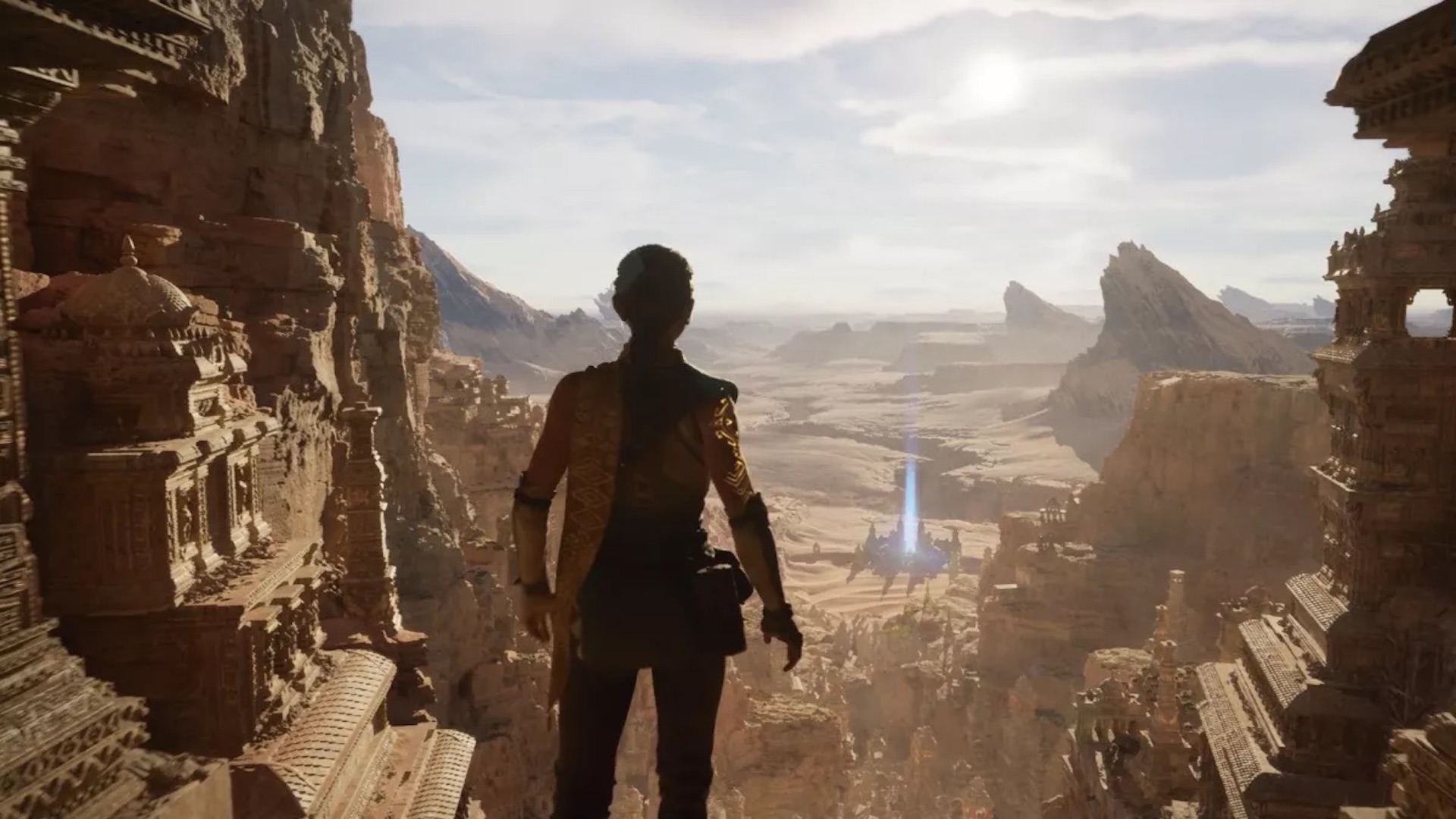A shot from the Unreal Engine 5 tech demo. A woman looks out over a desert landscape